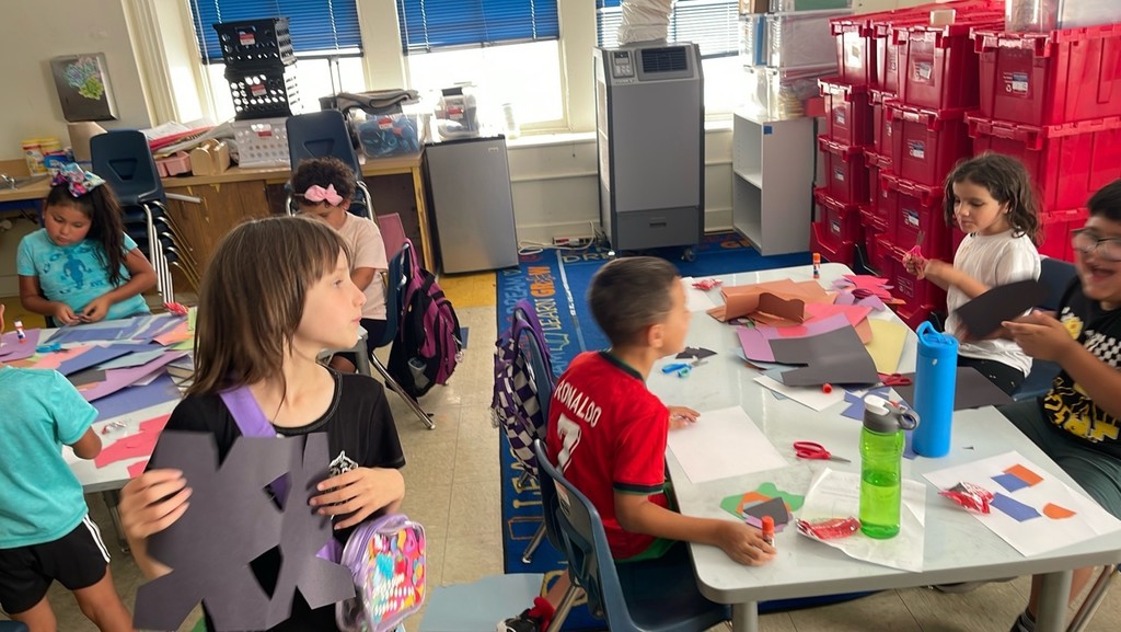 Students engaged in learning and art at summer learning