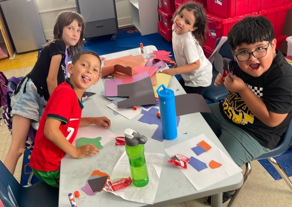 Students engaged in learning and art at summer learning
