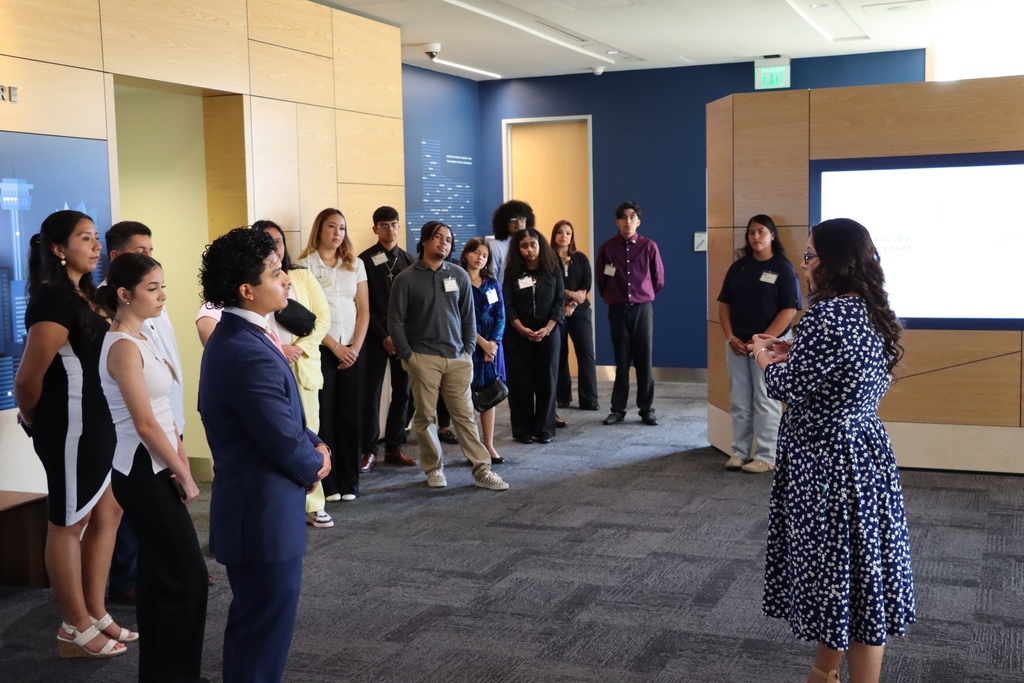 Woman speaks to students