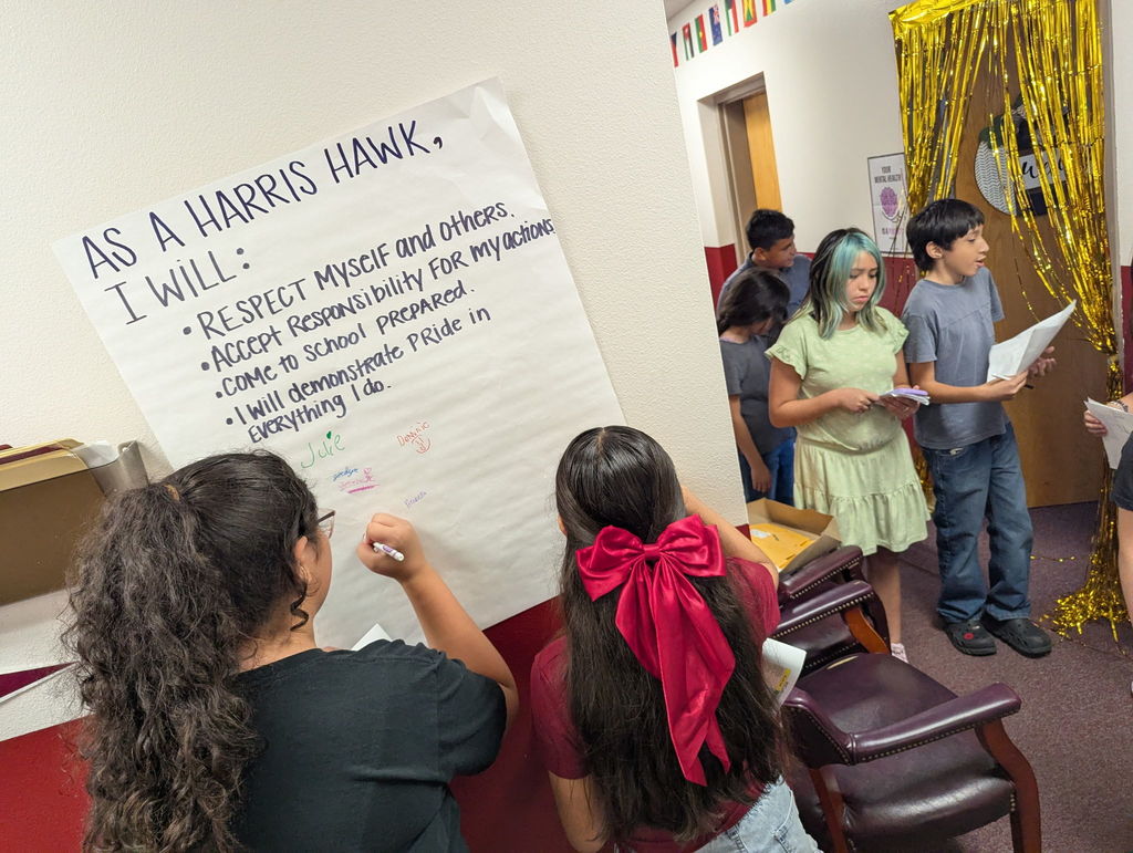 signing the harris hawk pledge