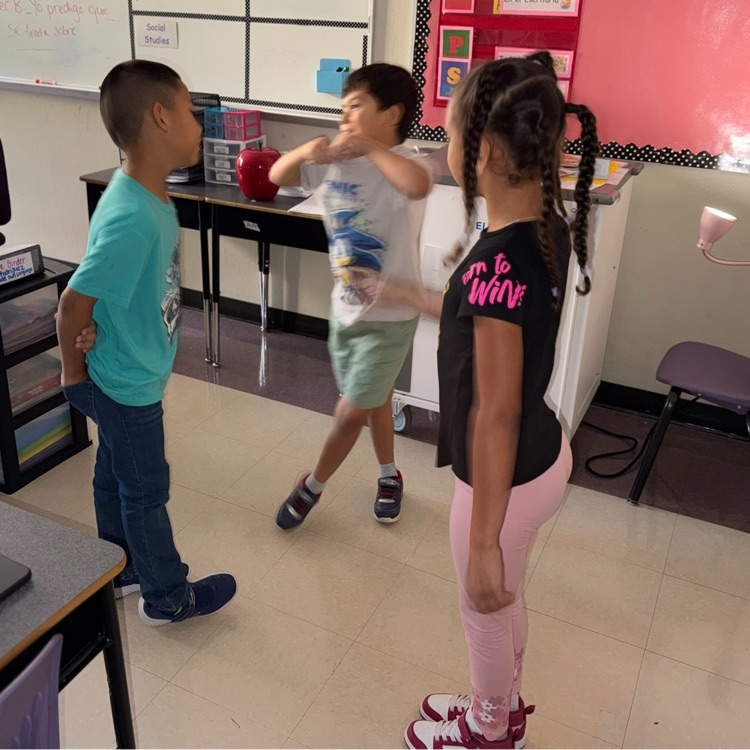 Students discuss their predictions. 