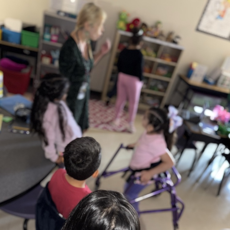 Ms Rios listens to and discusses student predictions.