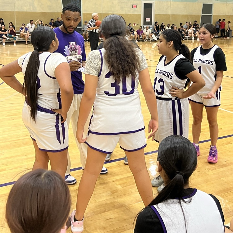 Coach Thomas talks with the Lady Bears during a timeout.