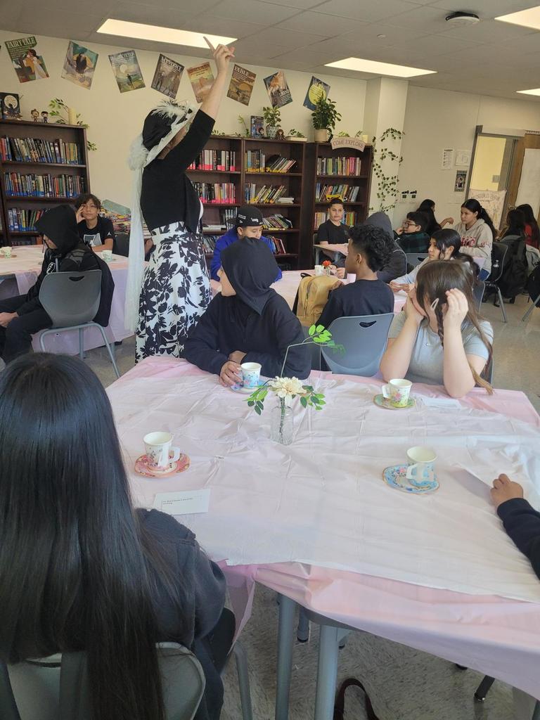 Students with teacher at tea party