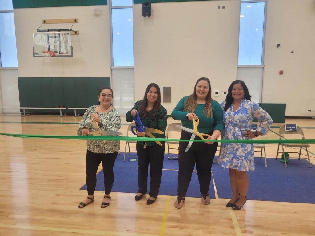 Admin cutting the ribbon