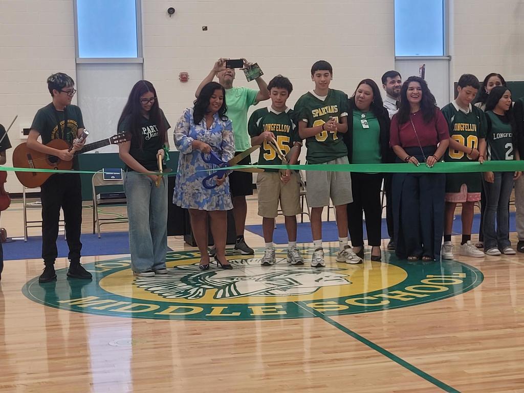 Principal/students cutting the ribbon
