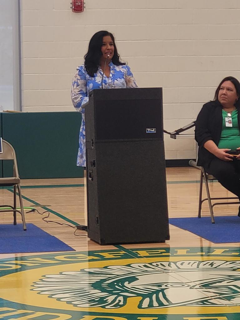 Principal Speaking at podium