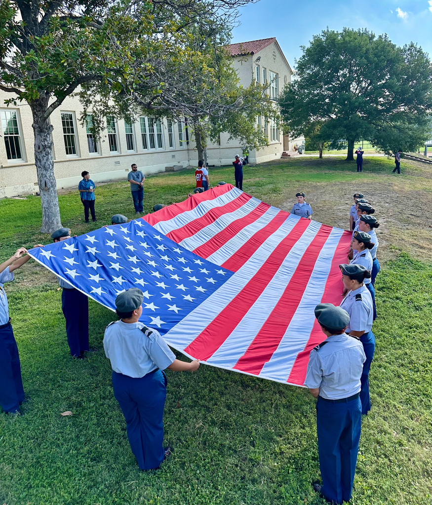 JROTC students hold large American flag