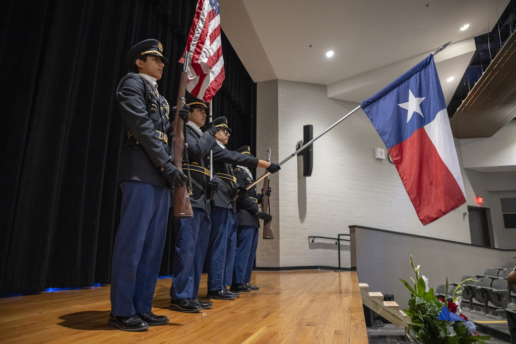JROTC students hold flags