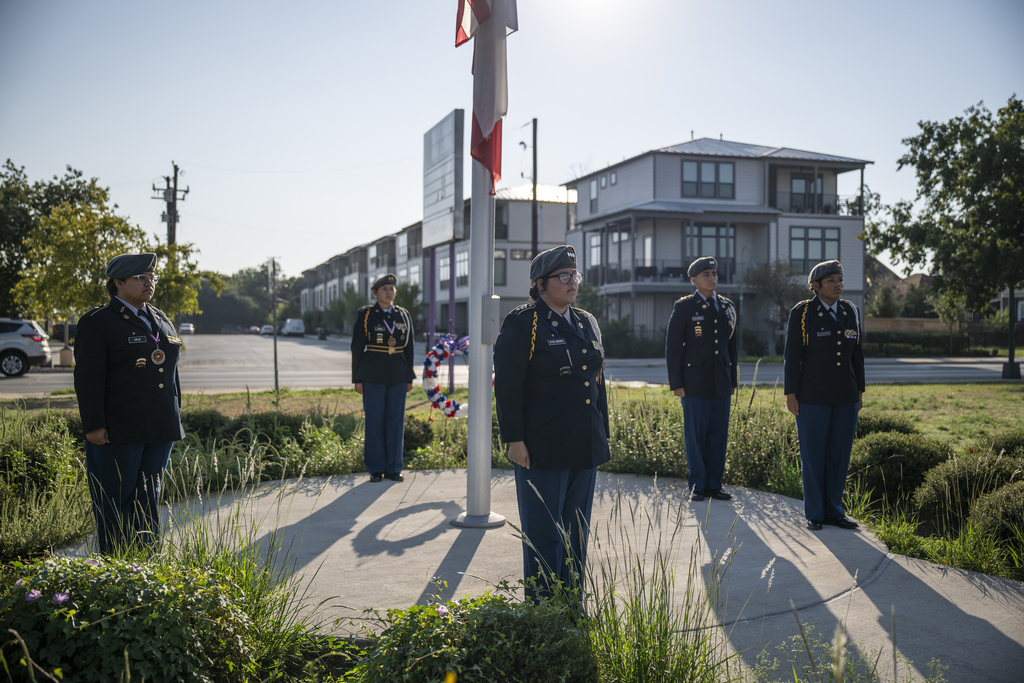 JROTC students stand at flag pole
