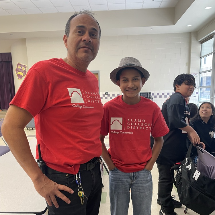 Mr. Sonnen sports college gear with a student.