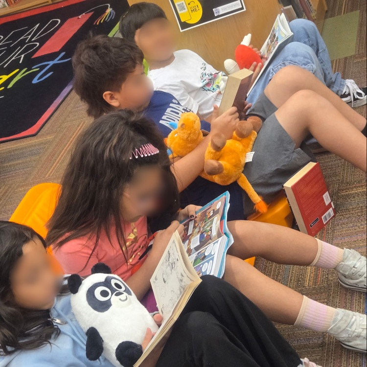 Students read with a reading buddy. 