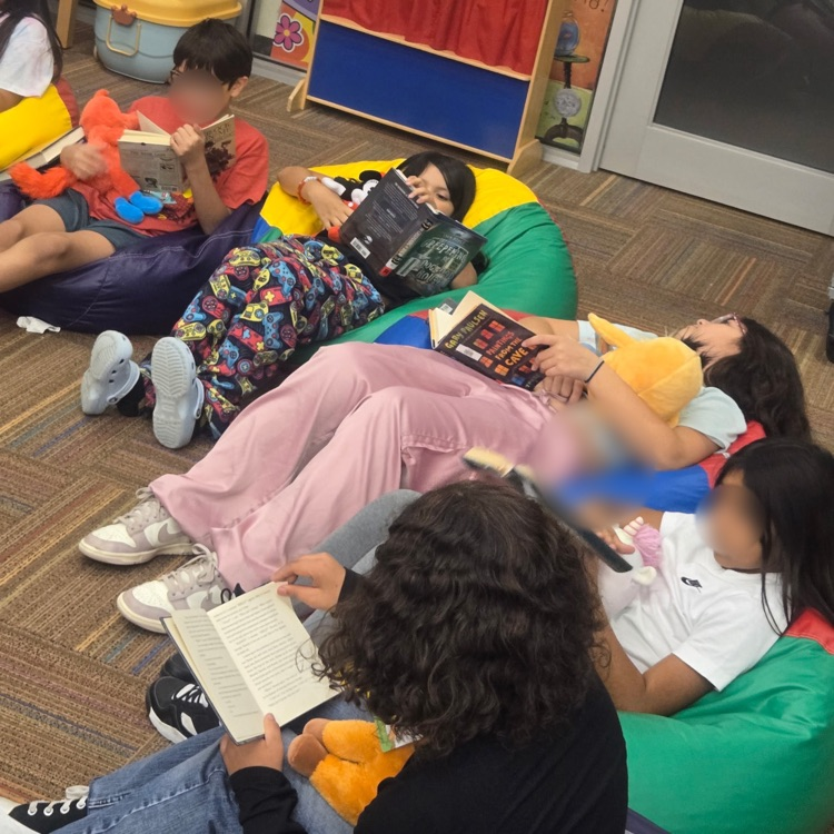Students read with a reading buddy. 
