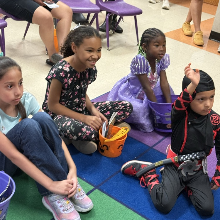 Students enjoy listening to spooky tales.