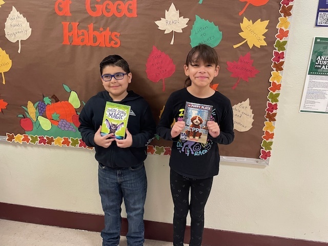 Students holding a book
