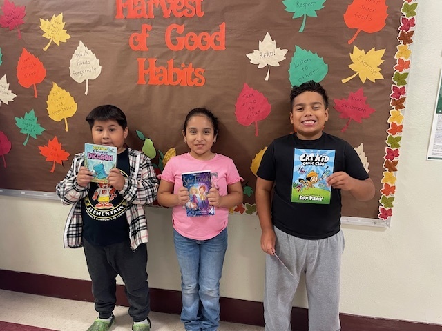 Students Holding a book