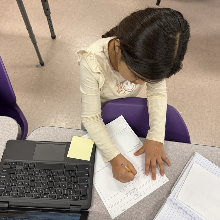 A student uses text evidence to complete their argumentative short constructed response.