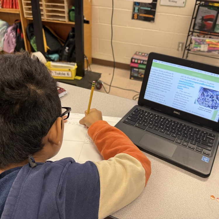 A student uses text evidence to complete their argumentative short constructed response.