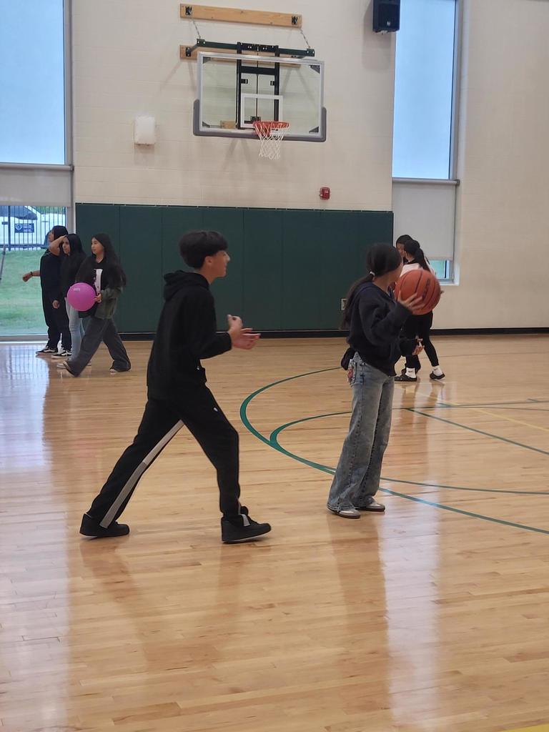 students playing basketball