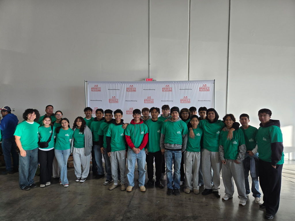 Edison Soccer players team gave back to the community, helping pack hundreds of "Boxes of Blessings".