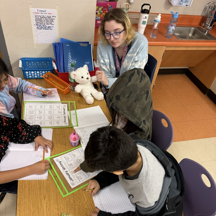 students at a writing station 
