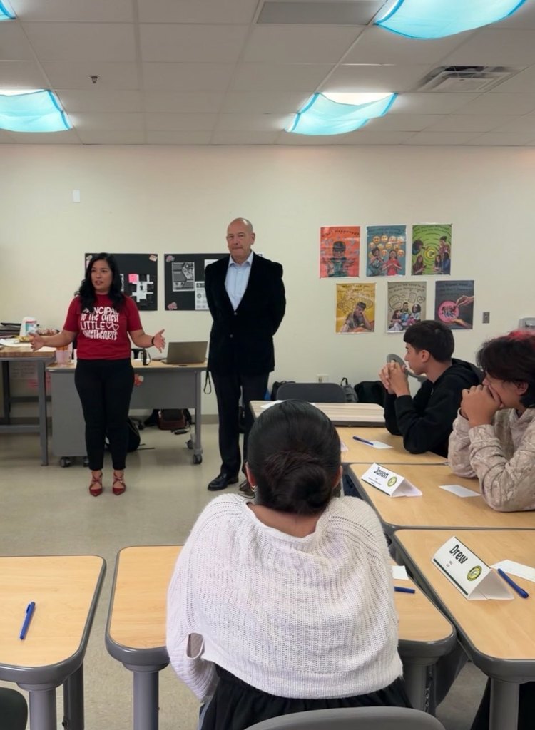 Principal speaking to students