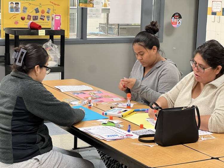Parents working on their vision boards