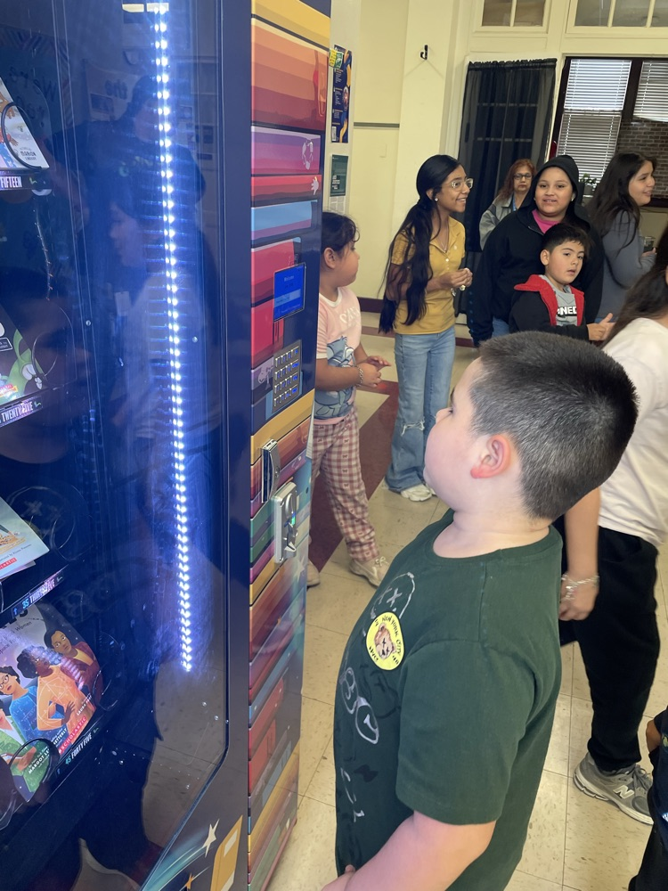 students at the book vending machine 
