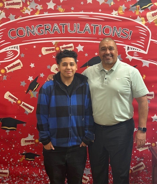 Graduate Kris Leal with Principal Becerra