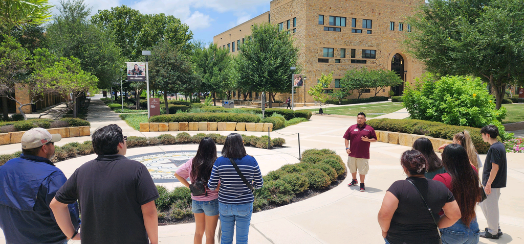 man, leading tour of campus