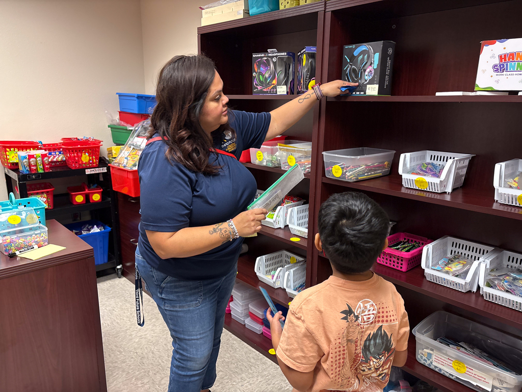 teacher helping student