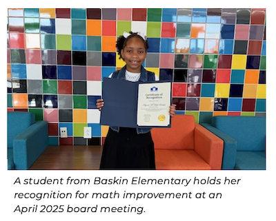 Female student holding board recognition
