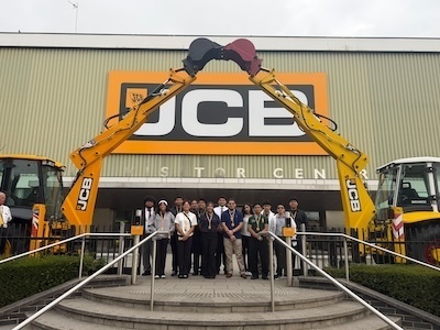 students in front of JCB Headquarters