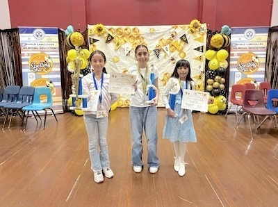 Three girls with trophies