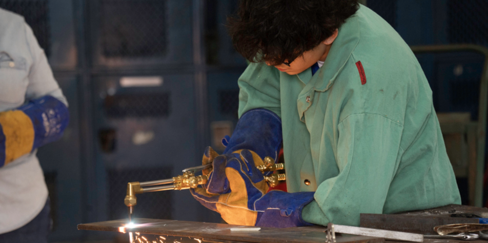 SDHS Freshman, Adrian Gonzalez, demonstrates metal cutting with an acetylene torch.