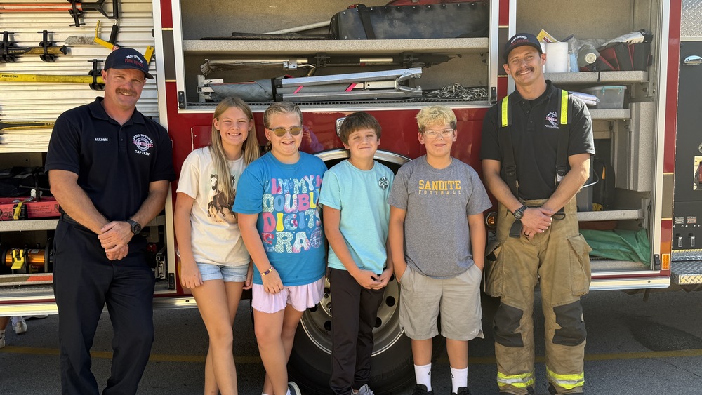 firefighters with students