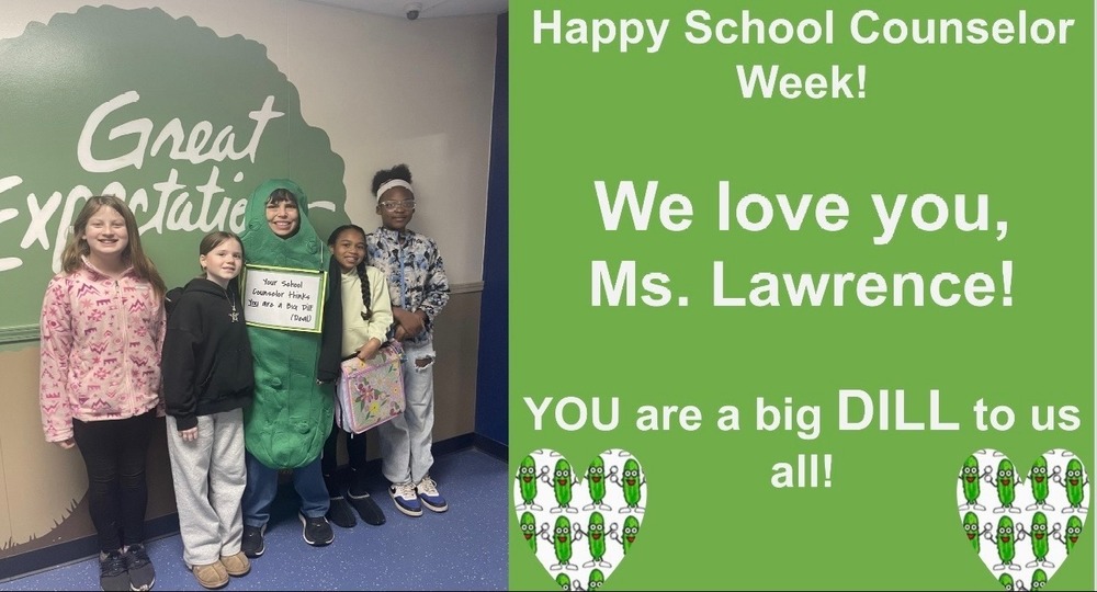 Mrs. Lawrence posing with students in front of our GE tree.