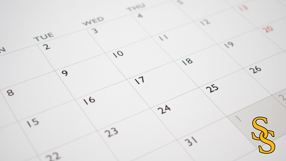 Calendar page showing days of the week and dates. Sand Springs interlocked "S" logo.