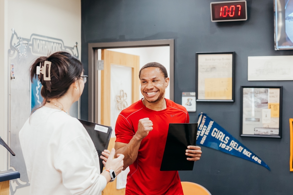 Teacher smiling and excitedly making a fist