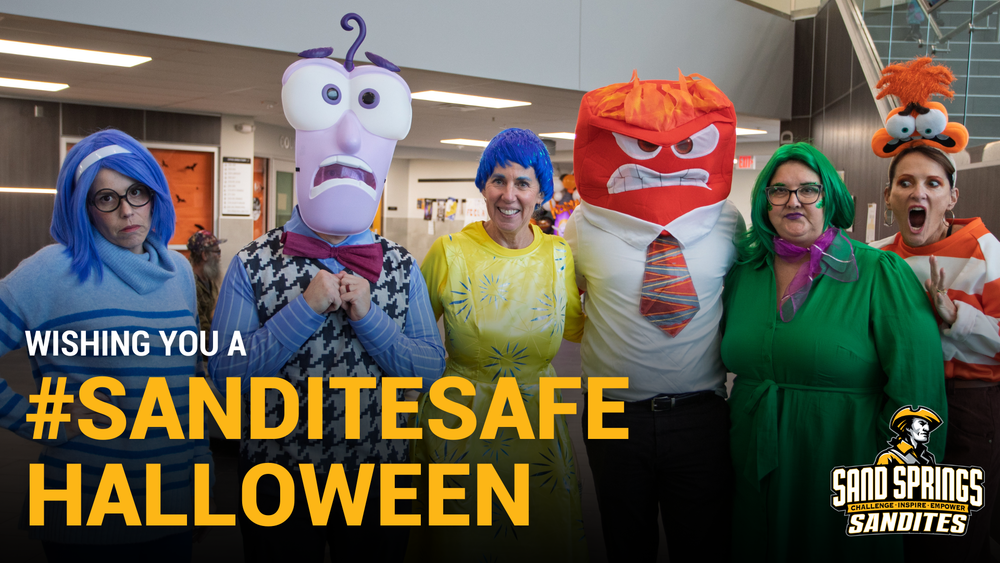 Six Sand Springs Public Schools staff members pose in costumes inspired by the movie Inside Out and other characters. The image includes the text “Wishing you a #SanditeSafe Halloween” with the Sand Springs Sandites logo in the corner.