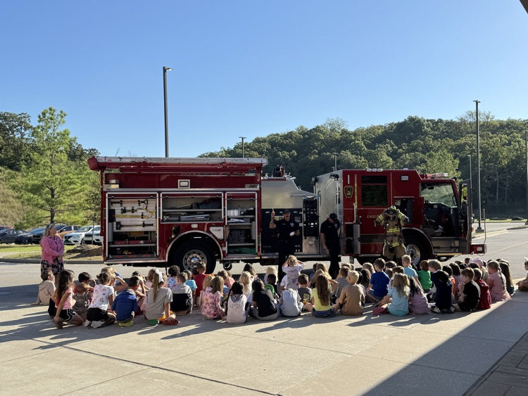 students looking at fire truck