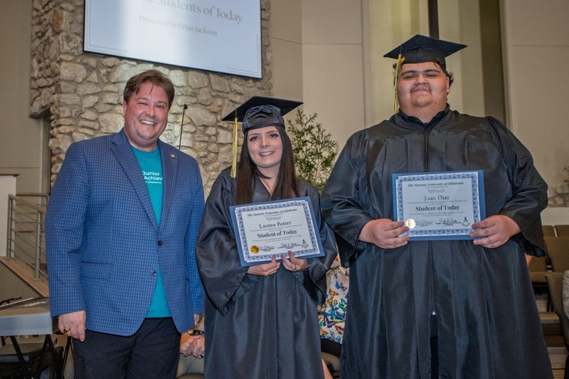 Brian Jackson presents two students with the Oklahoma Masonic Fraternity's Student of Today Award.