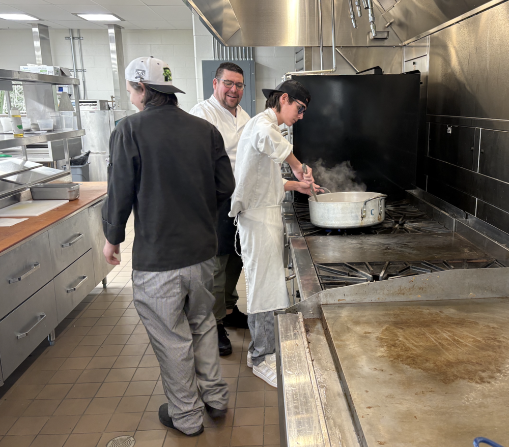 The Sanford Regional Technical Center's café reopened to the public in January, offering community members a chance to enjoy quality meals while supporting hands-on learning for culinary students. Chef Jethro Loichle, in his first year teaching the Culinary Arts program, brings over 30 years of cooking experience to SRTC.  "I learned in the field, so I have to show the students how to do it," he explained. His students cook three times daily, preparing meals that help them master essential techniques while serving the community. The café currently operates for lunch service on Wednesdays and Thursdays in January, featuring a French-themed menu with appetizers and desserts at $5 each and entrees for $10. Reservations must be made online through the SRTC website, as phone bookings are not available. The system accommodates parties of one to four people, and the café accepts cash or check only. Lunch service will pause in February and early March while seniors prepare for ProStart and SkillsUSA competitions, but the café will remain open for breakfast service during this time, when juniors will step up to run the morning operation, offering fresh pastries prepared by baking students. Second-year student Finnegan Lee describes the experience as transformative. "This program has already gotten me a job," he said, adding that classmates have landed positions at high-end restaurants in Portsmouth and beyond. Students rotate between front-of-house service and back-of-house cooking, gaining comprehensive hospitality experience. "We're like a small family in the classroom," said Lee, who is one of seven seniors, which includes Jaxson Condon, Jayden Doyle, Bowie McEllin, Sean Rioux, Azure Shrubsall, and Greg Warlo. In the baking and pastry program, second-year student Andre Roy is preparingFrench desserts for the café. "We start completely from scratch," Roy explained. "It was a French-themed menu, so we thought of French desserts and came up with a tart and a pancake. Then it takes about two days to prep." Roy plans to pursue culinary careers. The hands-on experience extends beyond regular service. Warlo, who works at York River Landing, appreciates how the program prepares students for real restaurant environments. "This is definitely a very high-action program," Finnegan explains. "You've got to be on your feet, ready to go." Chef Kristen Perry leads the new Baking and Pastry program, bringing experience from York County Community College and her own bakery in Wells. "Nowhere around here can you get baking and pastry training," she notes. Her students collaborate with culinary arts students, creating a dynamic learning environment where nearly 30 students cook together daily. The café also caters special events throughout the region, with all proceeds supporting student scholarships and program materials. 