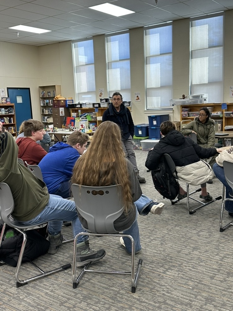 Seventh graders at Sanford Middle School recently wrapped up a meaningful interdisciplinary unit on the Holocaust, and they finished it in a pretty memorable way. Over the past several weeks, students have been exploring this important chapter in history through both their social studies and ELA classes. The two courses worked hand-in-hand to give students a well-rounded understanding of the Holocaust — from the historical facts and context to the deeply human stories behind them. To bring it all home, students had the chance to experience something truly special: a live performance by Russell Kaback called 25044: A Musical Story of Resilience. In the show, Kaback shares the story of his own grandfather, a Holocaust survivor, through music and storytelling. It's the kind of performance that sticks with you, and for our 7th graders, it served as a powerful capstone to everything they'd been learning in the classroom. We're proud of our students for engaging so thoughtfully with such a significant and weighty topic, and grateful to performers like Russell Kaback for keeping these important stories alive.