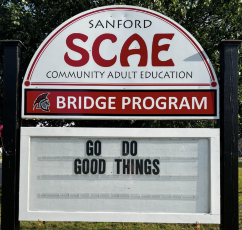 For some students, the path to a diploma can feel overwhelming, filled with barriers that seem impossible to overcome. But at Sanford Community Adult Education, Director Jayne Perkins and her team are working to change that narrative. Through an innovative partnership with Maine Career Exploration and local businesses throughout Sanford, the program is creating real pathways to careers while helping students earn their high school credentials and develop essential life skills. Sanford Community Adult Education is working with Maine Career Exploration to offer paid apprenticeships of up to 75 hours. Students earn money while gaining real-world work experience in fields that match their interests. The process is simple: employers complete paperwork, and within three days, students can begin their apprenticeship. Most students work three to four hours per week, allowing them to balance their education, work, and personal responsibilities. Current and upcoming placements include the Downtown Shagg on Main Street, where a student will learn customer service and business operations, and Goodall Memorial Library, where one interested in library science will gain hands-on experience. The program is also exploring opportunities with local accounting firms and creative businesses for students interested in finance and digital art. Sue Zimmer, SCAE’s Maine College and Career Access Advisor, works to match students with opportunities and find the right fit. "I know my students, talk to them, start calling around and cross my fingers that someone will eventually say yes," she explains. "For some of our students, this is literally their first time making money, or the first time in a long time," Zimmer notes. "This program is forcing them to not only get work experience but also get a bank account, get an ID—it's helping young people learn how to be adults." For a young person who has never had an ID or a bank account, this apprenticeship becomes more than just a job—it's a complete introduction to adulthood, with support every step of the way. "Taking that first step is huge—walking through the door and saying 'I need my diploma’, it takes a lot of courage'" Perkins said. "These students get the opportunity and they get the support. It's the first time they've had such a positive opportunity, and to have someone walk them through it, step-by-step, give them the support. So they get the opportunity, and they get the support. And as you see in graduation, they find success most of the time. It’s life changing for them." The programs are designed to meet students exactly where they are. The program's new website features Google forms where prospective students can share their contact information and interests. Since launching the online contact form, 29 students have reached out for information. One recent conversation illustrates the program's impact. A 35-year-old woman kept saying she was too old to pursue her diploma. When Perkins told her, "You're not too old for this. Let's do this," they worked together to create a plan for her to graduate in June. The woman cried, grateful that someone believed in her. "So many times when I call, people say 'I can't believe that you're calling and that this is really happening,'" Perkins said.
