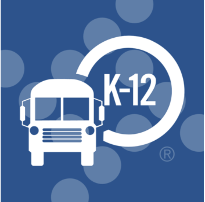 A school bus with a sign reading K-12.