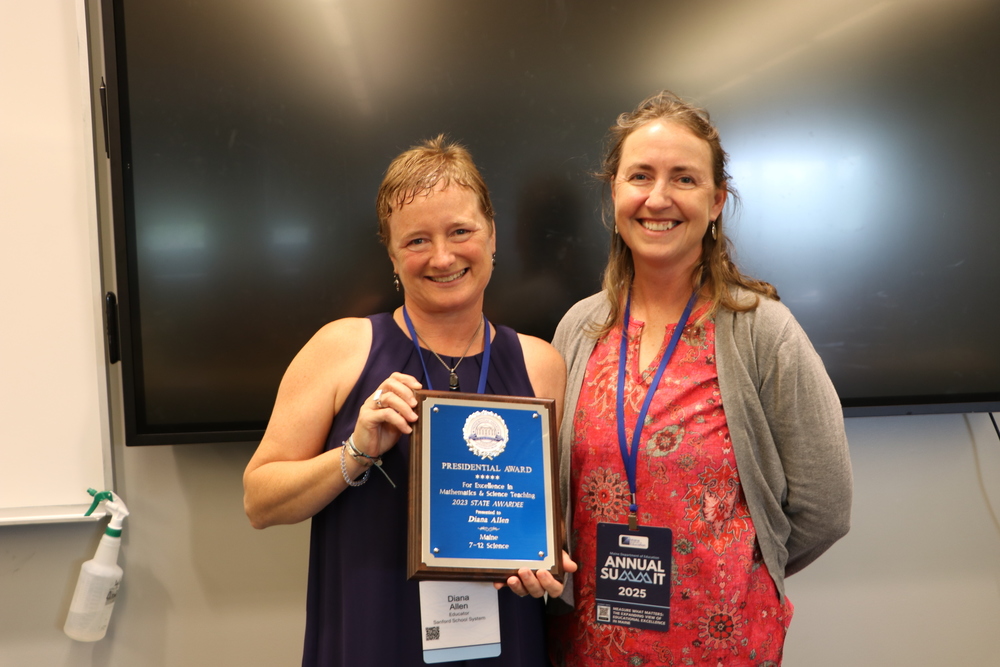 Sanford Middle School science teacher Diana Allen was recently honored at the Maine Department of Education Annual Summit in August as a recipient of the Presidential Awards for Excellence in Mathematics and Science Teaching (PAEMST). Back in January, Allen was one of 336 educators nationwide to receive the award, which is the highest recognition a K-12 mathematics or science teacher can get from the U.S. government. Related: (Diana Allen Receives Presidential Teaching Award) Allen, who was initially selected as one of three Maine state finalists, completed an intensive application process that required demonstrating deep content knowledge and adaptability to diverse learning environments. Her application included a recorded teaching demonstration at a local brook, where she partnered with Maine Audubon to teach students about macroinvertebrates. The process required detailed analysis of teaching practices, addressing student misconceptions, managing classroom diversity, and demonstrating educational leadership at local, state, and national levels. During the MDOE summit, Diana was presented with her award by Tonya Prentice, joining an elite group of Maine educators who have earned this distinguished recognition. Her selection reflects not only her classroom excellence but also her commitment to fostering scientific thinking and discovery among her middle school students.
