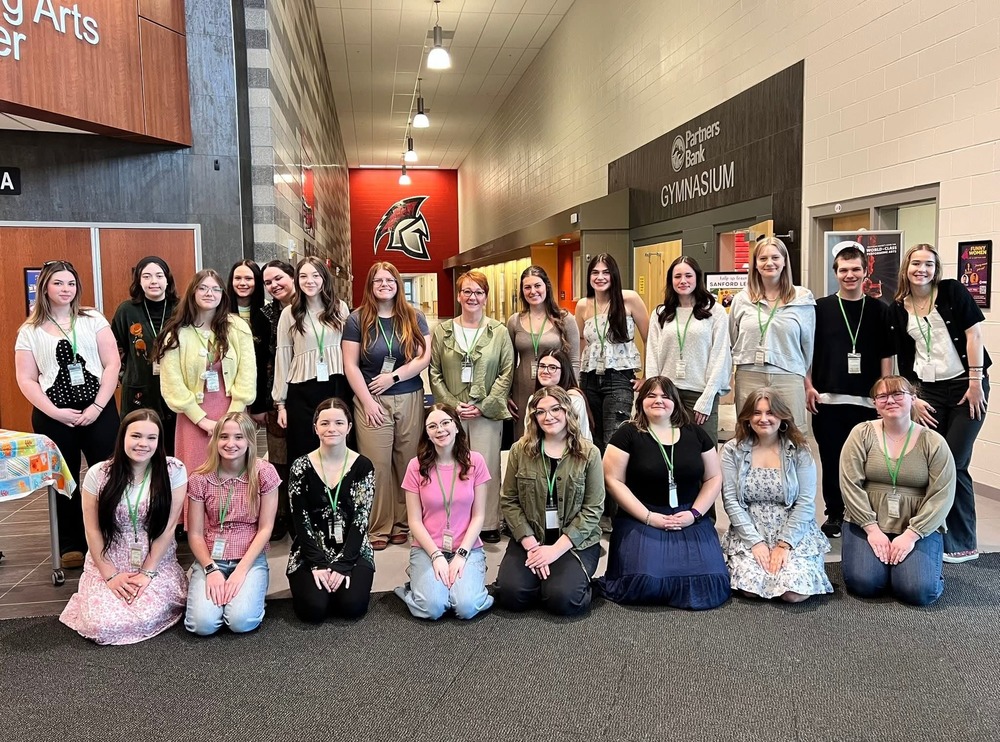 For the third consecutive year, Sanford High School and the Sanford Regional Technical Center (SRTC) opened their doors to welcome early childhood professionals from across Maine for the York County Early Childhood Coalition's (YCECC) Early Childhood Education Conference. On Saturday, April 4, more than 200 attendees gathered under one roof for a full day of professional growth, including registrants, presenters, vendors, and SRTC's own Early Childhood Education students.  Hosting the conference has become a point of pride for Sanford, and this year was no exception. The school's Performing Arts Center, classrooms, café, and Agora were all put to use throughout the day, giving the event a true sense of place and community. From registration through the final door prize drawing, Sanford provided the space and support that made the conference possible.  Held under the theme "Seeds of Inspiration: Growing Educators and Young Children with Heart and Guidance," the conference offered seven hours of professional training for those who work directly or indirectly with children from birth through the third grade.  The day began in the Performing Arts Center with a welcome and an opening panel discussion titled "Mentorship, Compassion, and Growth," bringing together perspectives from both mentors and mentees and inviting questions from the audience. Attendees then had time to network and explore more than 20 vendor tables before the first of three breakout sessions. Topics across the day included Language and Literacy Strategies, Reframing Behavior as Communication, Universal Design for Learning, and the Regulated Classroom.  A catered lunch by local caterer Above and Beyond was served in the café, giving participants a chance to recharge and connect before the afternoon sessions. The day wrapped up in the Agora with door prize drawings featuring items generously donated by vendors and the distribution of certificates recognizing each attendee's seven hours of training.  The York County Early Childhood Coalition is dedicated to strengthening the network of professionals and services that support young children and families throughout the region.