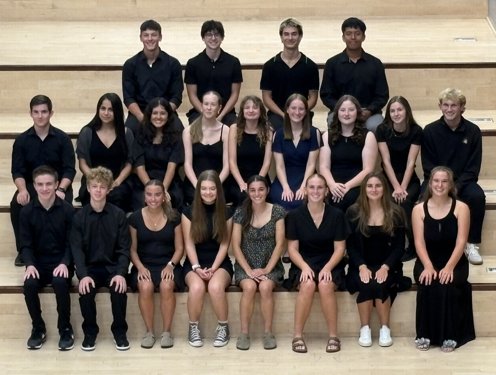 Over twenty Sanford High School students were inducted into the National Honor Society Wednesday, September 17, in the Performing Arts Center. The induction ceremony honored students who have demonstrated commitment to the four pillars of NHS: Scholarship, Service, Leadership, and Character.  The ceremony brought together families, faculty, and friends to celebrate these students' achievements. The evening featured the traditional candle lighting ceremony, symbolizing the illumination of knowledge and the commitment these students make to uphold the values of NHS. "The evening was truly amazing. It is such a privilege to honor and work alongside such an extraordinary group of students," NHS Advisor Liz White said. To qualify for National Honor Society membership, students must maintain a cumulative GPA of 3.5 or higher and demonstrate significant involvement in school and community service activities. Beyond academic excellence, candidates undergo a selection process that evaluates their leadership roles, character references, and service contributions. The newly inducted members represented a diverse group of students with achievements across many areas. The inductees include dedicated performers in theater, marching band, and choir and varsity athletes in soccer, baseball, tennis, and track and field, as well as Many are pursuing specialized programs through Sanford Regional Technical Center, including welding, health occupations, and engineering design. Their post-graduation plans are equally impressive, ranging from aerospace engineering and medicine to musical theater and education, demonstrating the breadth of talent and ambition within this exceptional group. "The students' unwavering support for one another truly shines through," White reflected. "Moments like this reveal the remarkable caliber of character that defines our chapter. Their actions speak louder than any speech could, and honestly, it doesn't get much better than that." Following the ceremony, families and inductees gathered in the cafeteria for refreshments, celebrating this achievement together.  Congratulations to the following inductees: Eliza Allen, Morgan Bailey, Alessandra Castro, Adam Cote, Tyler Do, Gavin Ericson, Ava Fagan, Keaghan Gagnon, Kaylee Gauthier, Addison Hoenig, Ami Kane, Michael Kiley, Nathan Maloney, Levi Mann, Hazel Marcinowski, Zoey McCann, Yashvi Patel, Lily Peters, Belinda Rivard, Paige Sevigny, Veerasak Sungvean.