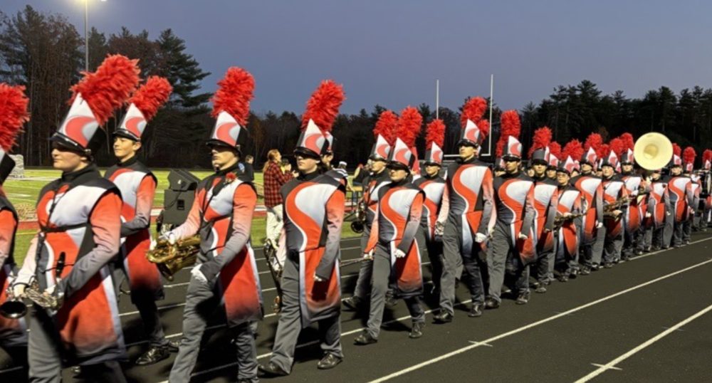 Sanford High School will host the Maine State Marching Band Finals on Saturday, October 25, at Alumni Stadium, marking the fourth consecutive year the school has welcomed bands from across Maine and New Hampshire to compete. The competition begins at 4:00 p.m., with the Sanford High School marching band scheduled to perform at 7:30 p.m. There is an admission fee. Eleven bands will compete throughout the evening, including Merrimack Valley, Lake Region, Biddeford, Lawrence, Blue Hawks, Westbrook, Old Orchard Beach, South Portland, Wells, Dover, and Sanford. A brief intermission is scheduled at 6:30 p.m. Sanford's theme for this year's performance is Echoes of the Earth. As finals week approaches, the band has focused their preparation on execution. "We're doing a lot of energy, a lot of music work, and just really focusing," Sanford junior Morgan Bailey said. "Now that we have the drill ability, we're starting to add the finishing touches." The band is looking to repeat last year's gold medal performance at state finals, where they earned five-star ratings across all categories including Music, General Effect, Color Guard, Percussion, Visual, and Drum Major. This year, the band's path to finals has included five competitions this season, opening at Biddeford High School on September 13, then traveling to UMass Amherst, followed by competitions at South Portland on October 4 and Wells High School on October 18. Sanford has become the natural choice to host the state finals due to its facilities and experience, according to SHS Band Director Hailey Francoeur. Alumni Stadium's combination of ample parking, a turf field, and spacious bleachers makes it an ideal venue for accommodating the bands, spectators, and equipment that a statewide competition requires. For Bailey, this season's highlight came at the US Bands competition at UMass Amherst. "We got to see so many other different schools and stuff, see a bigger community and larger families," Bailey said. That competition resulted in a first-place finish in Division 2A on September 27. This past weekend, the band continued their winning streak by earning four out of five stars in all categories at their MBDA competition. Francoeur emphasized that the band's success wouldn't be possible without the Music Boosters, who provide snacks before every Tuesday and Thursday rehearsal, prepare lunches before Saturday competitions that run from 9:00 a.m. to 9:00 p.m., and help with everything from sewing costumes to hauling trailers. For more information about volunteering for the state finals or supporting the band program, contact Director Hailey Francoeur at Sanford High School.